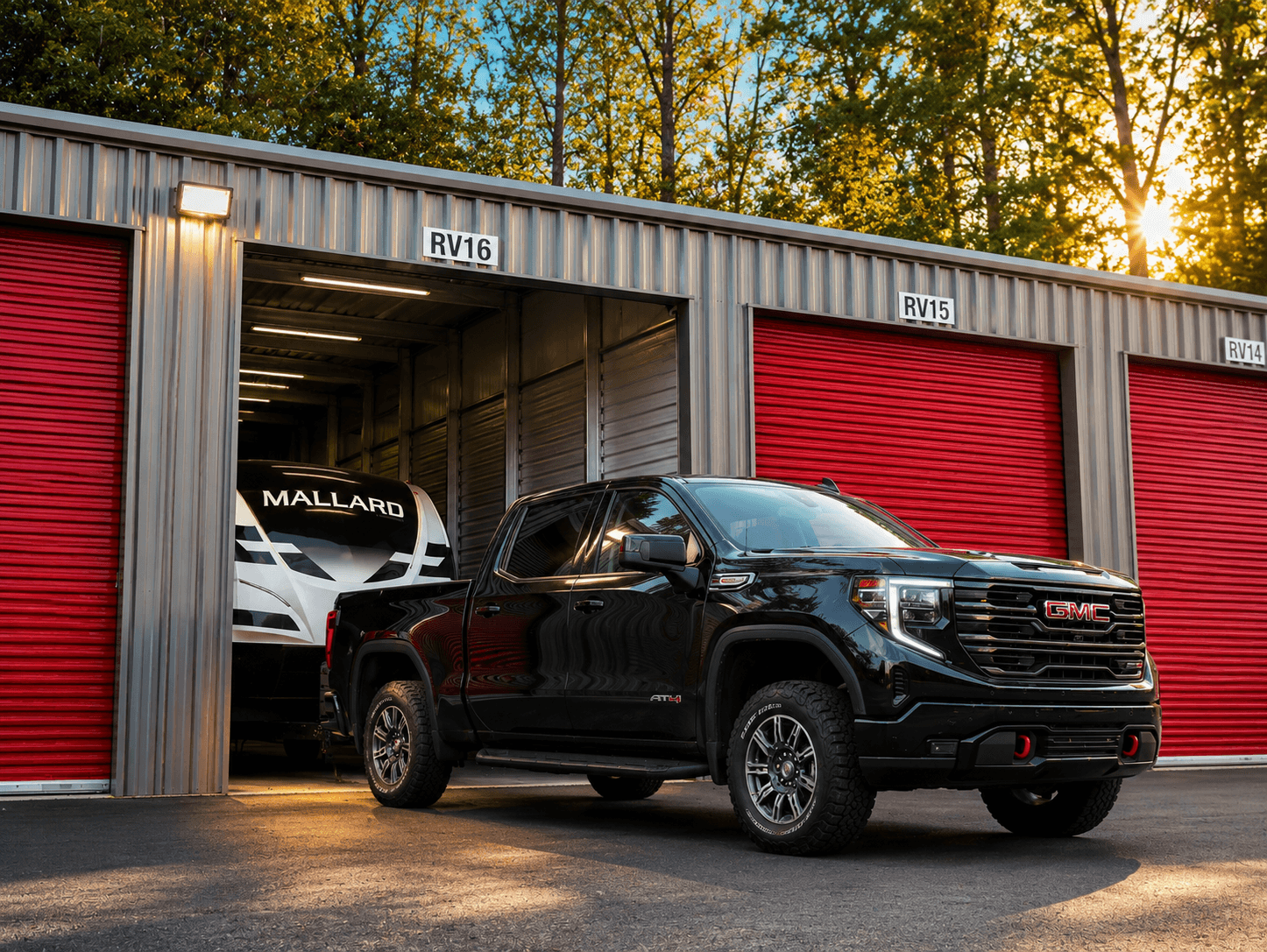 Truck and travel trailer at Modern Storage® drive-up RV storage at sunset — boat, RV, and lake storage for Hot Springs area lakes including Lake Hamilton, Lake Ouachita, and Lake Catherine